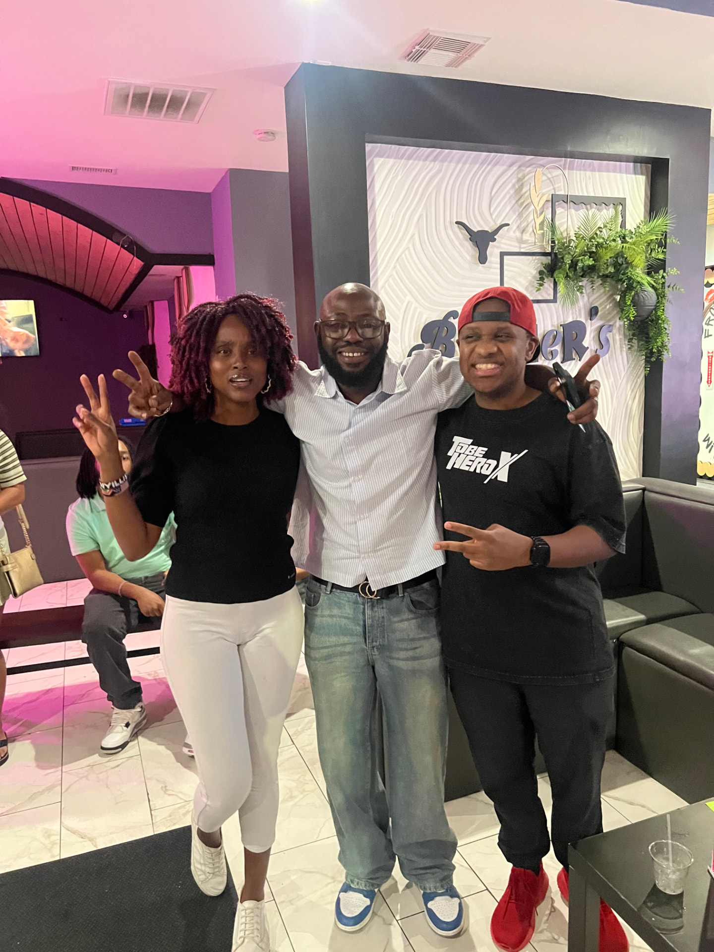 Three guests celebrating together after a game night